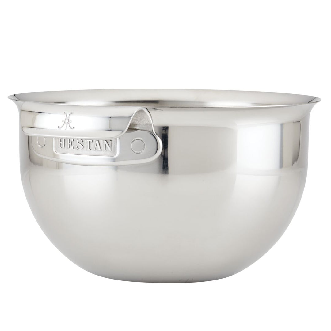 The Hestan Provisions 7qt Stainless Steel Mixing Bowl features a large capacity, reflective finish, sturdy handle, embossed branding, and is dishwasher safe for easy cleanup. Set against a plain white background.