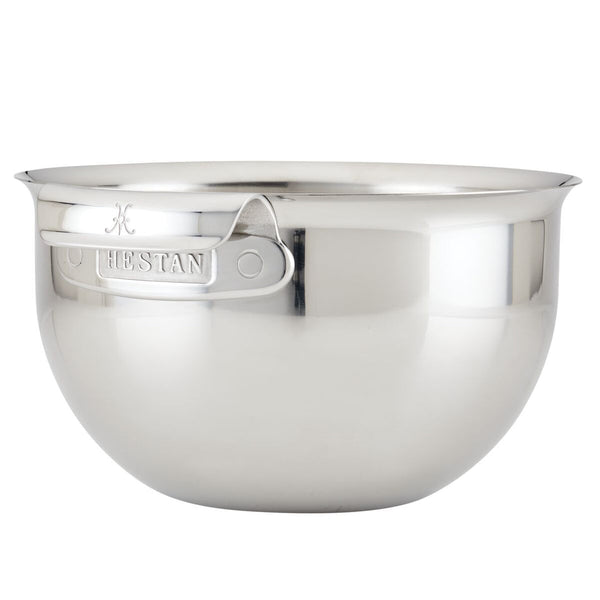 The Hestan Provisions 7qt stainless steel mixing bowl features a handle and the brand name "Hestan" elegantly embossed on the side.