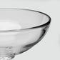 Close-up of a Simon Pearce Stratton Bowl made of clear glass with a thick, rounded rim.