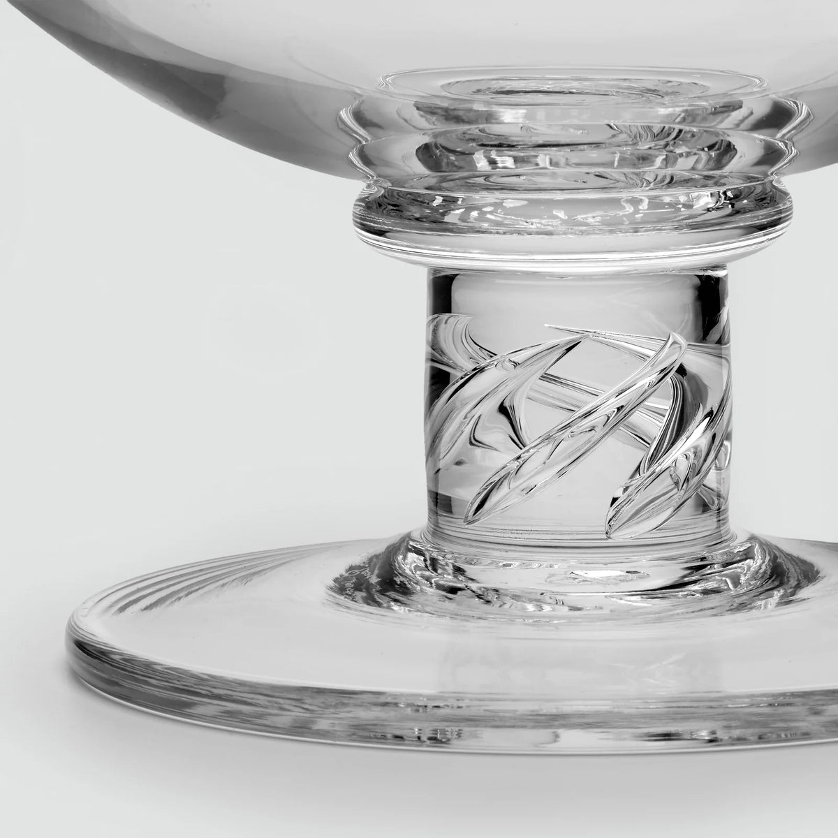 Simon Pearce Stratton Bowl made of clear glass, featuring a pedestal base with a twisted, spiral-design stem.