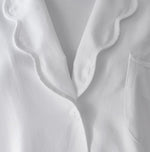 Close-up of the Sue Nightshirt by Haute Home in cotton sateen, with wavy collar, single white button, chest pocket, and ribbed white undershirt—a touch of refined comfort in elegant sleepwear.