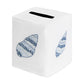 White tissue box cover from Haute Home’s Speckled Conch Coaster & Bath Collection, crafted from luxurious Italian linen and adorned with blue embroidered seashell motifs, featuring a convenient top slot for dispensing tissues—a sophisticated accent for any refined linen home decor.