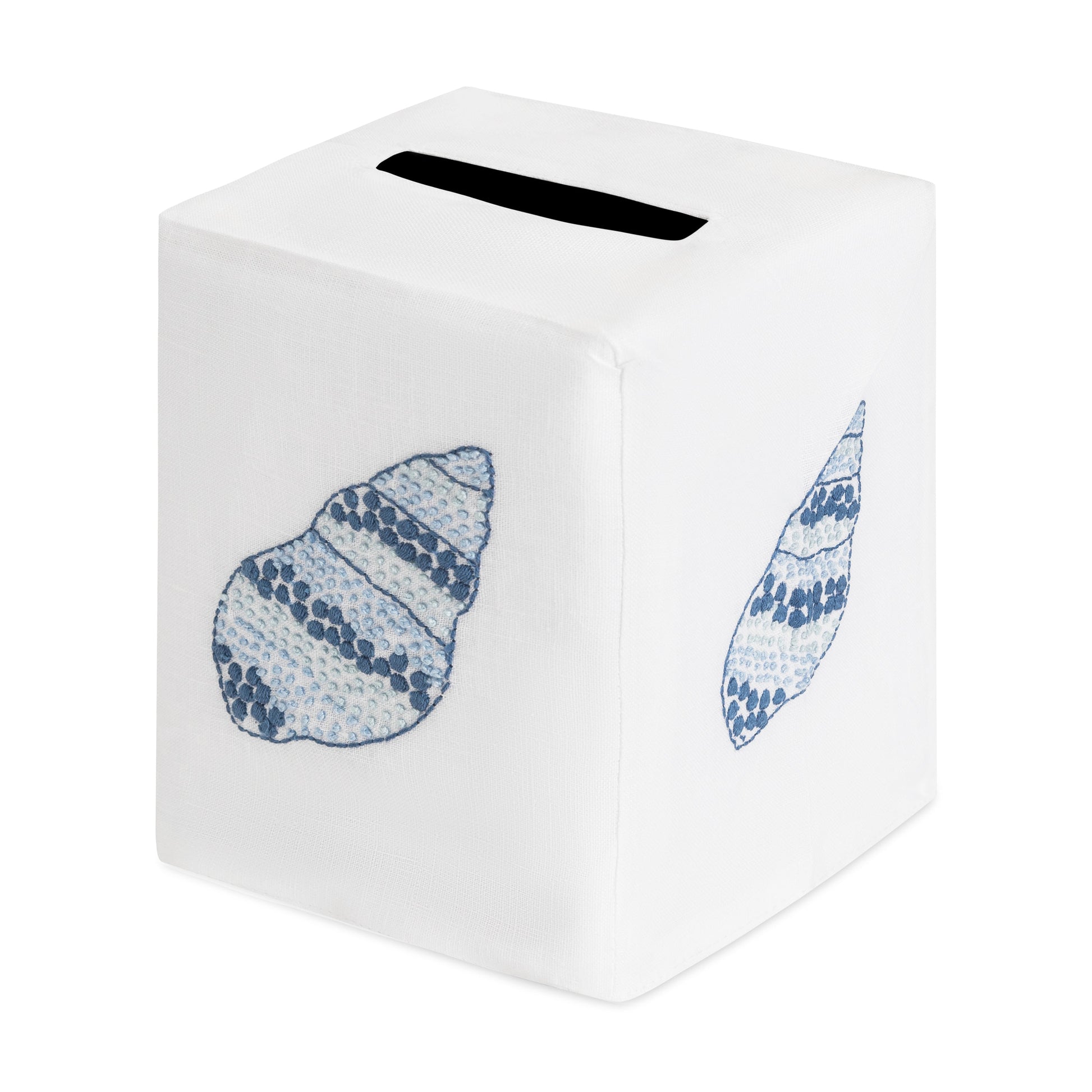 White tissue box cover from Haute Home’s Speckled Conch Coaster & Bath Collection, crafted from luxurious Italian linen and adorned with blue embroidered seashell motifs, featuring a convenient top slot for dispensing tissues—a sophisticated accent for any refined linen home decor.
