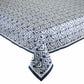 The Alfresco Tablecloth by Kim Seybert features a blue and white geometric design inspired by traditional Indian block printing and is made from 100% cotton.