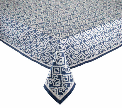 The Alfresco Tablecloth by Kim Seybert features a blue and white geometric design inspired by traditional Indian block printing and is made from 100% cotton.