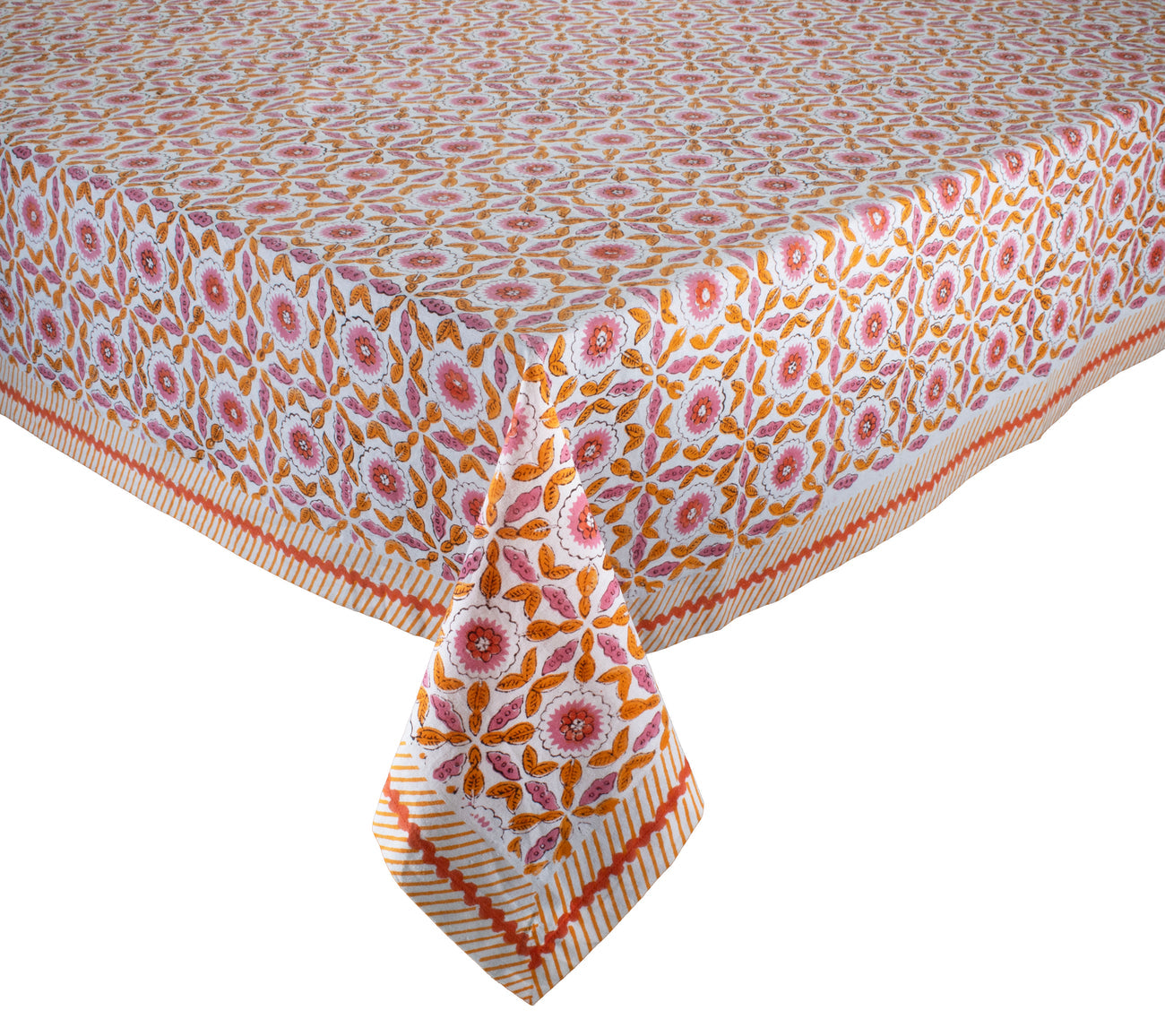 A rectangular table adorned with a Kim Seybert Majorelle Tablecloth Collection piece, showcasing orange and pink florals, a striped border, and intricate handmade Indian block print details.