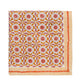 Square fabric napkin from the Kim Seybert Majorelle Tablecloth Collection, showcasing a floral and leaf motif in orange, pink, and white with a diagonal striped border—evoking the charm of Indian block printing.