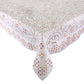 The Kim Seybert Malta Tablecloth Collection features a rectangular white tablecloth with elegant cutwork and decorative geometric and floral patterns in shades of grey, gold, and red.