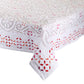 The Malta Tablecloth Collection by Kim Seybert features intricate red, pink, and gray stitched patterns with exquisite cutwork, making it an elegant addition to any table décor.