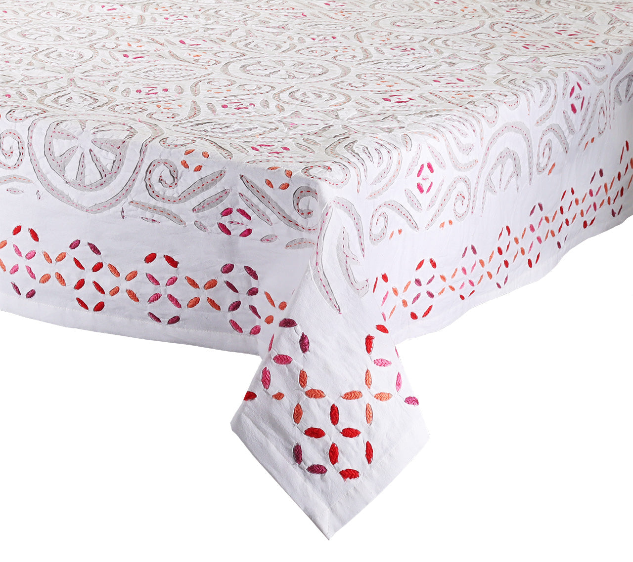 The Malta Tablecloth Collection by Kim Seybert features intricate red, pink, and gray stitched patterns with exquisite cutwork, making it an elegant addition to any table décor.