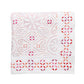 The Malta Tablecloth Collection by Kim Seybert features a folded white tablecloth with pink and red embroidered geometric and floral patterns, perfect for elegant table décor.