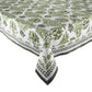 The Botanica Tablecloth Collection by Kim Seybert features a rectangular white cloth with a green leafy botanical pattern and dark green border, bringing elegance to any setting.