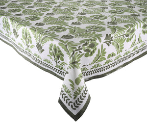 The Botanica Tablecloth Collection by Kim Seybert features a rectangular white cloth with a green leafy botanical pattern and dark green border, bringing elegance to any setting.