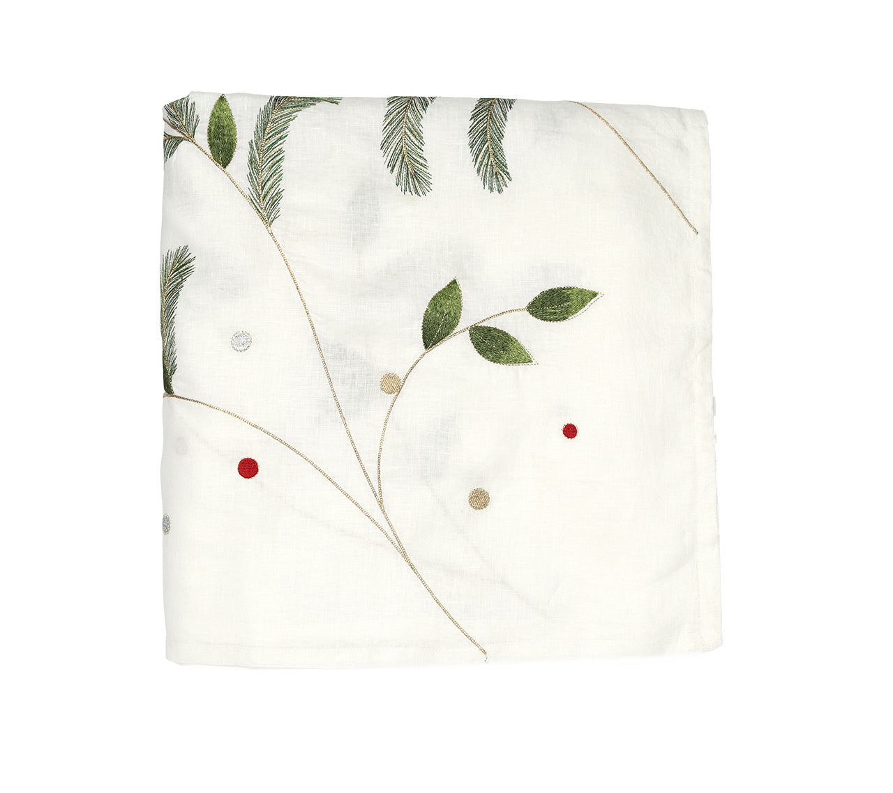 The Christmas Carol Table Linen Collection by Kim Seybert features a folded white embroidered linen napkin with green leaves, pine needles, and red and beige accents—ideal for a festive holiday table.