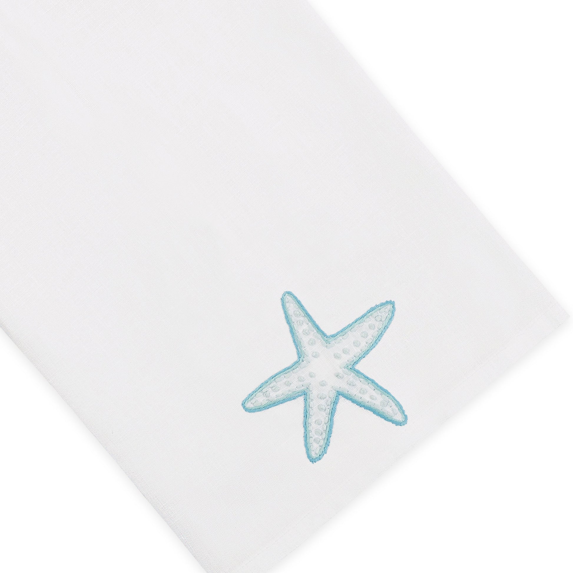 Elevate your home décor with the Playful Starfish Bath Collection from Haute Home—a white, premium linen napkin adorned with a light blue embroidered starfish in one corner for a touch of elegance.