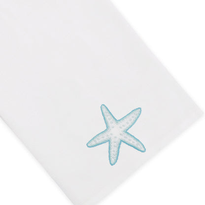 Elevate your home décor with the Playful Starfish Bath Collection from Haute Home—a white, premium linen napkin adorned with a light blue embroidered starfish in one corner for a touch of elegance.
