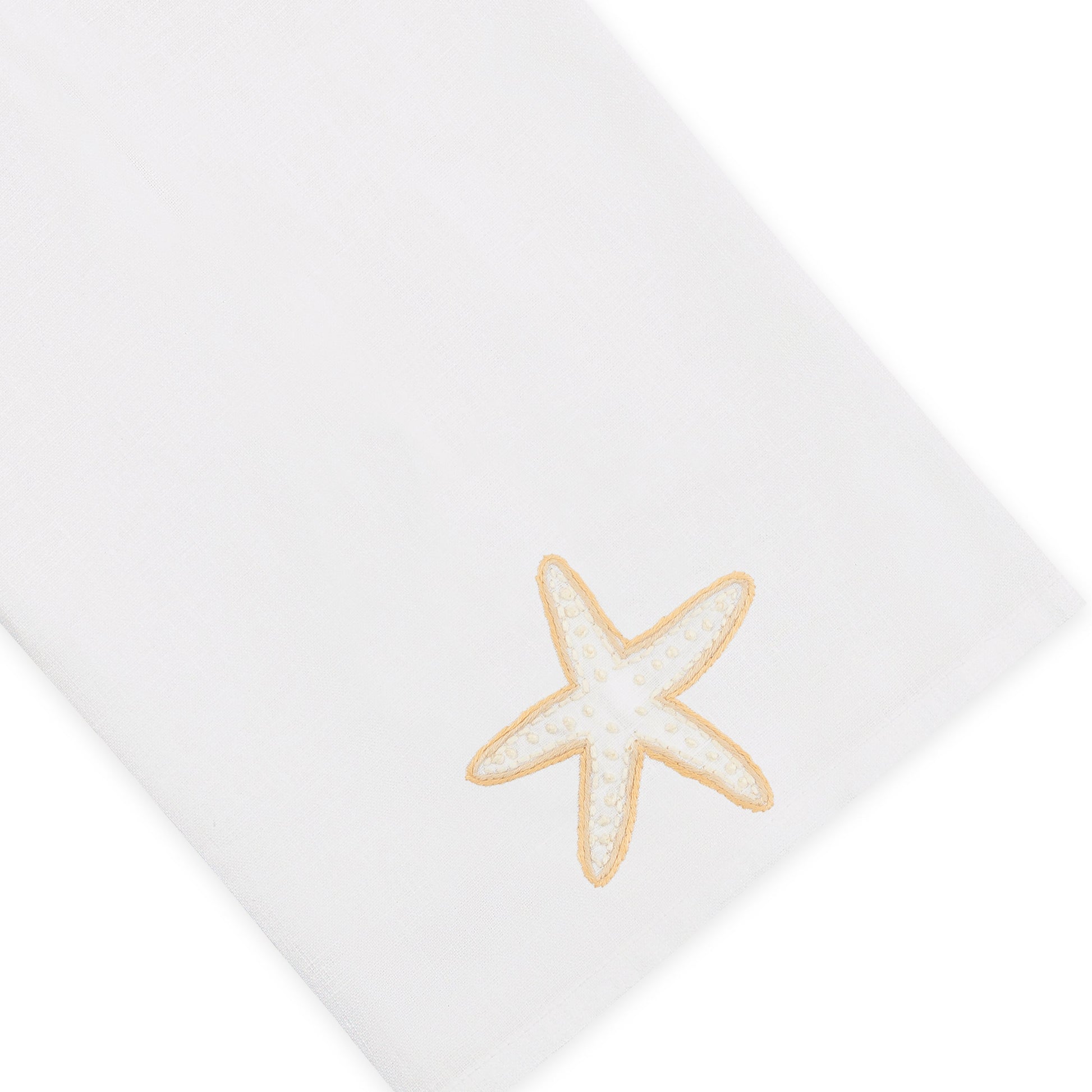 The Haute Home Playful Starfish Bath Collection includes a white linen napkin adorned with a beige and white embroidered starfish in one corner, shown on a plain background—a subtle yet elegant addition to your home décor.