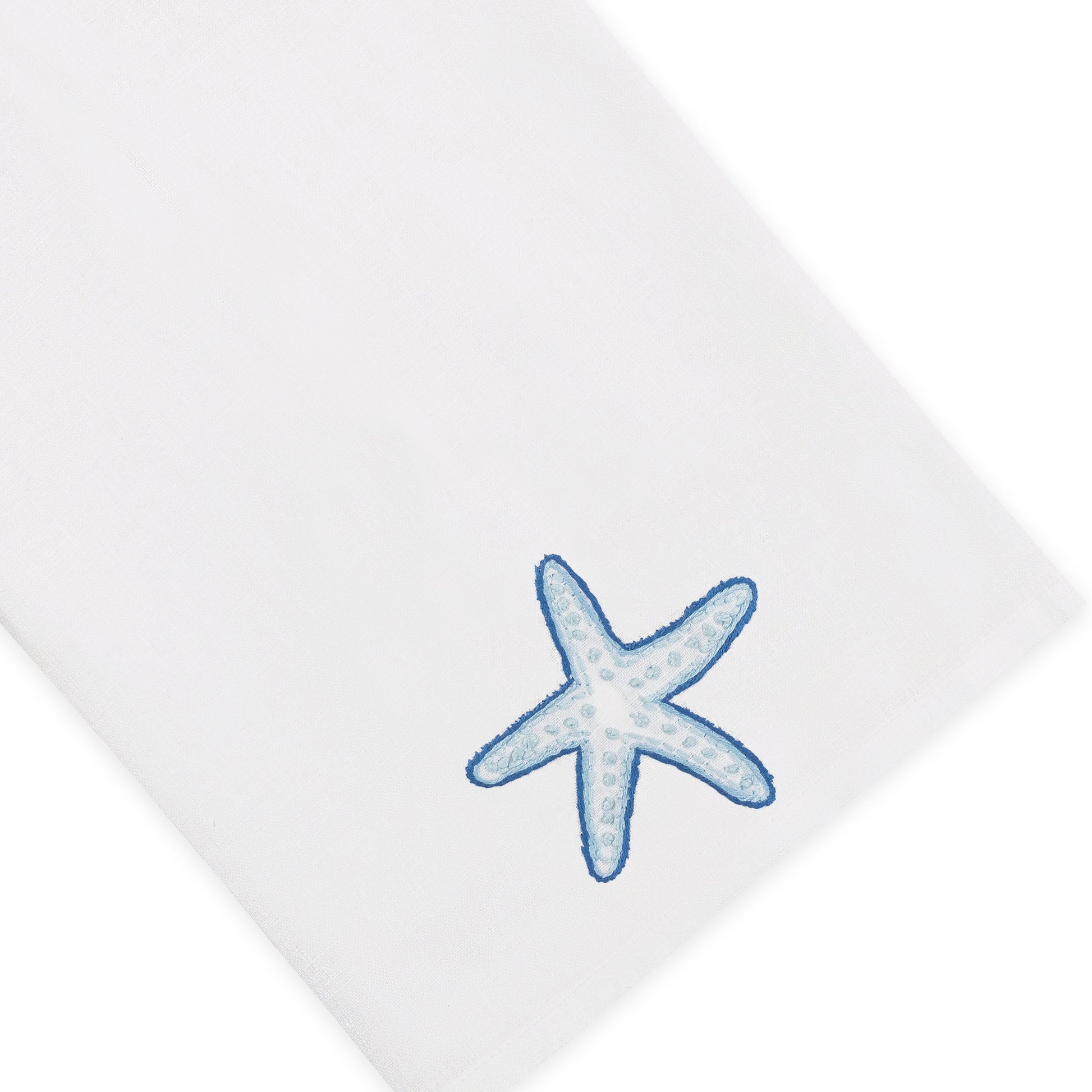 Elevate your home décor with the Playful Starfish Bath Collection from Haute Home: a white premium linen fabric napkin featuring a blue starfish embroidered in one corner, combining elegance with coastal charm.