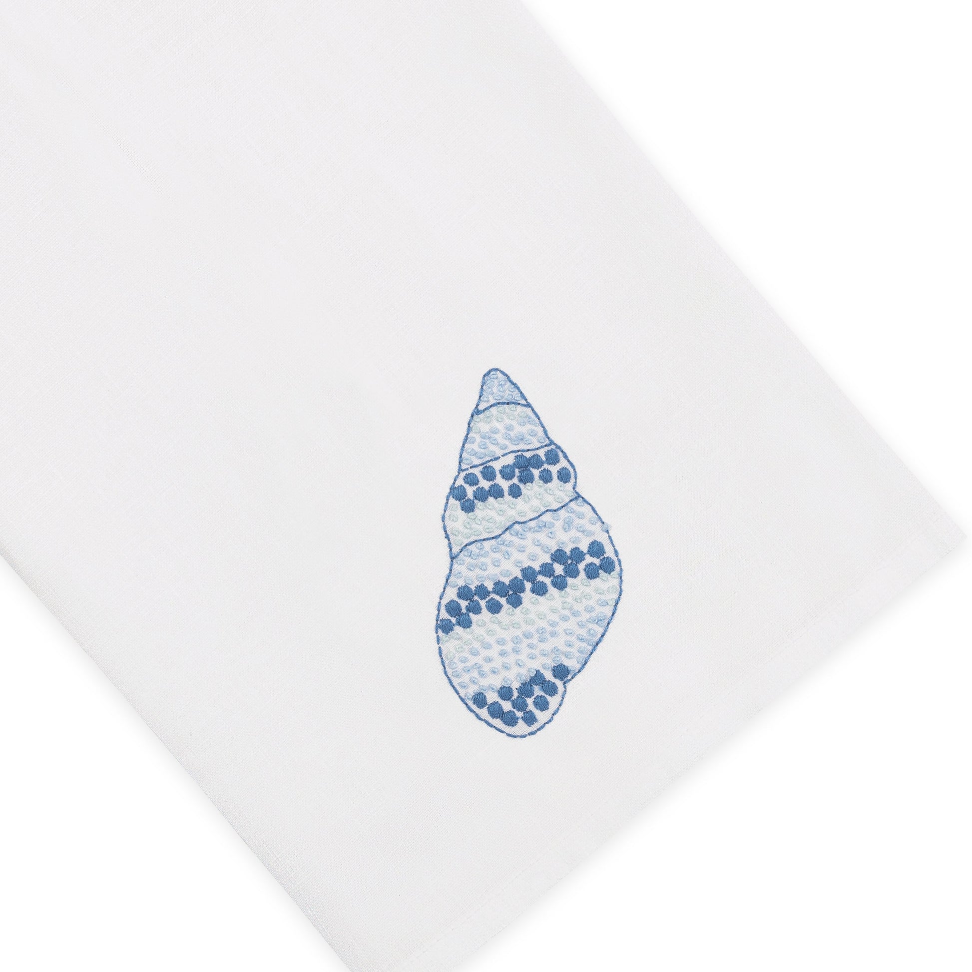 Crafted from white Italian linen and adorned with a blue speckled conch illustration near the corner, Haute Home’s Speckled Conch Coaster & Bath Collection brings a touch of coastal elegance to your linen home decor.