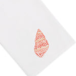 Bring a touch of Italian linen elegance to your home decor with the Haute Home Speckled Conch Coaster & Bath Collection—a white cloth featuring an embroidered orange and beige seashell design in one corner.