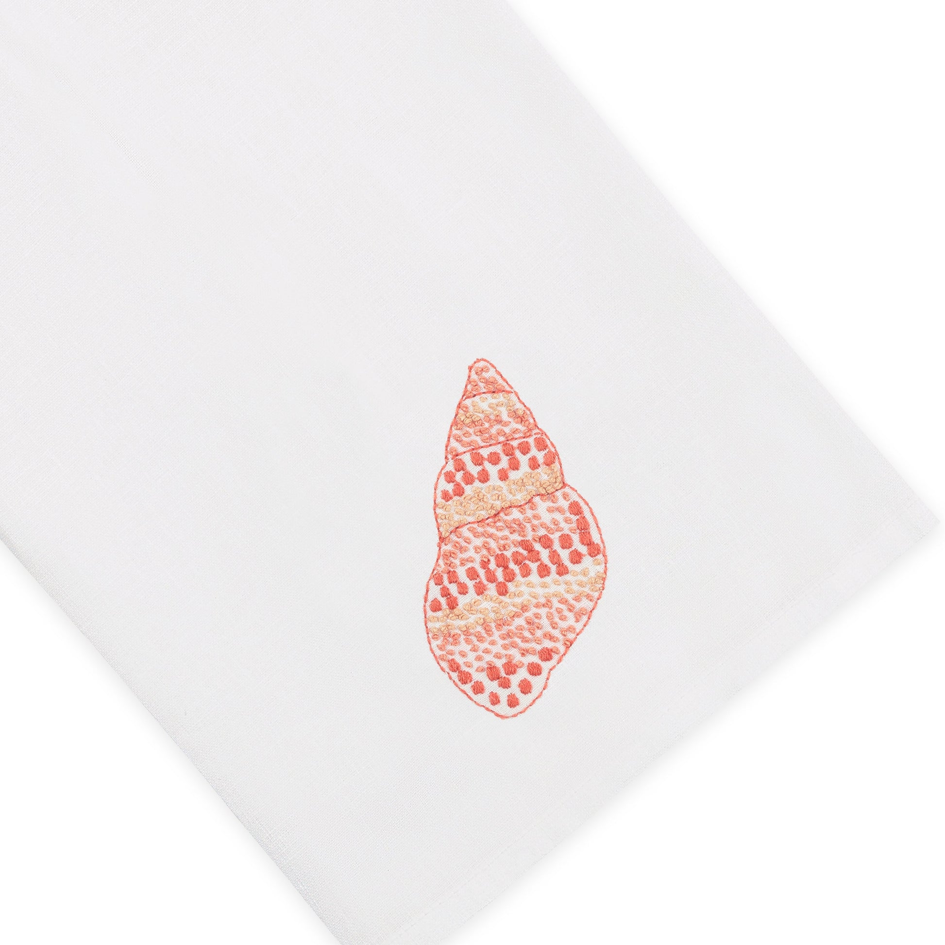 Bring a touch of Italian linen elegance to your home decor with the Haute Home Speckled Conch Coaster & Bath Collection—a white cloth featuring an embroidered orange and beige seashell design in one corner.