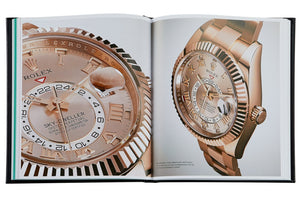 An open book showing detailed images of two rose gold wristwatches, perfect for aspiring Rolex collectors seeking to spot fakes with confidence can be found in "The Book of Rolex" by Graphic Image.