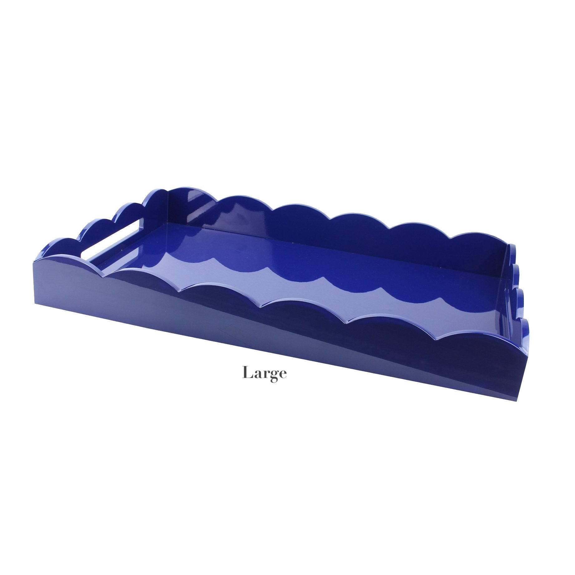 The Addison Ross Scalloped Navy Lacquer Tray Collection features glossy navy trays with scalloped edges and cutout handles, elegantly showcasing the brand’s signature style.