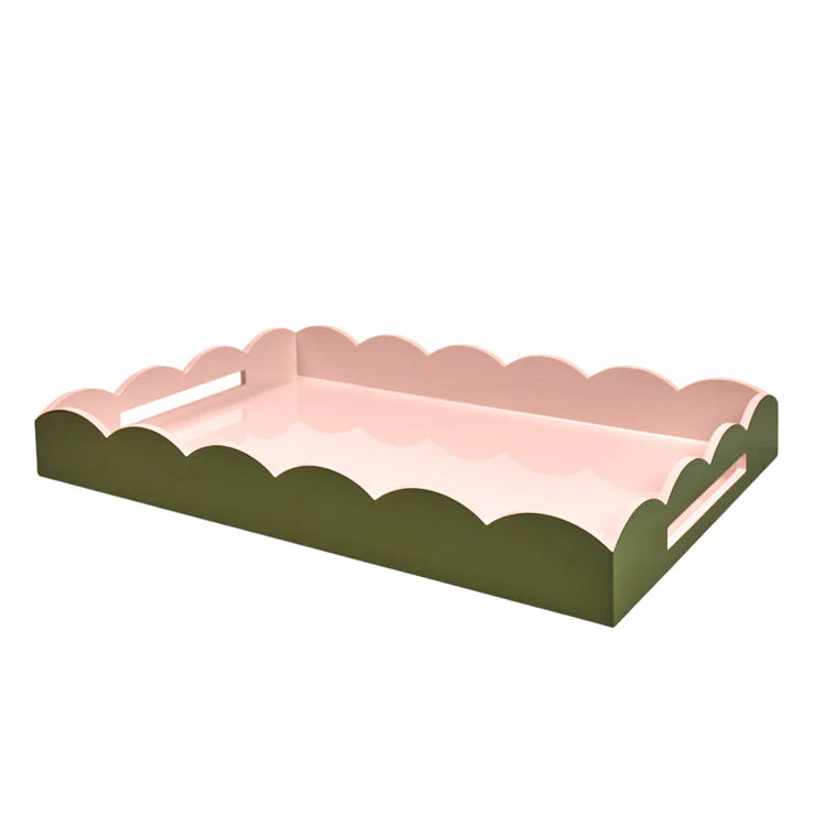 The Addison Ross Two-Tone Scalloped Lacquer Tray Collection features pink trays with scalloped edges and a high-gloss finish.