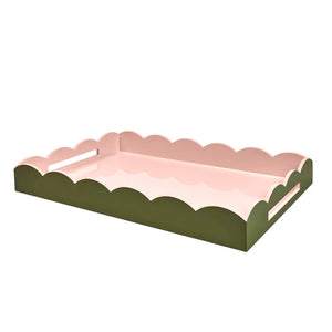 The Addison Ross Two-Tone Scalloped Lacquer Tray Collection features pink trays with scalloped edges and a high-gloss finish.