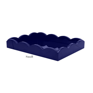 The Addison Ross Scalloped Navy Lacquer Tray Collection features small rectangular trays with a glossy finish, elegant scalloped edges, and subtle branding.