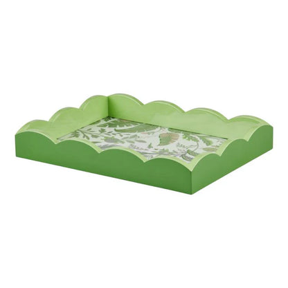 The Palm Beach Scallop Tray Collection by Addison Ross features green rectangular trays with scalloped edges and a leafy botanical base, ideal for adding a tropical flair to your décor.