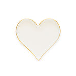 The Bordered Heart Trinket Tray by Sugar Paper is a white, heart-shaped ceramic piece featuring elegant gold details along its thin rim, shown against a plain white background.