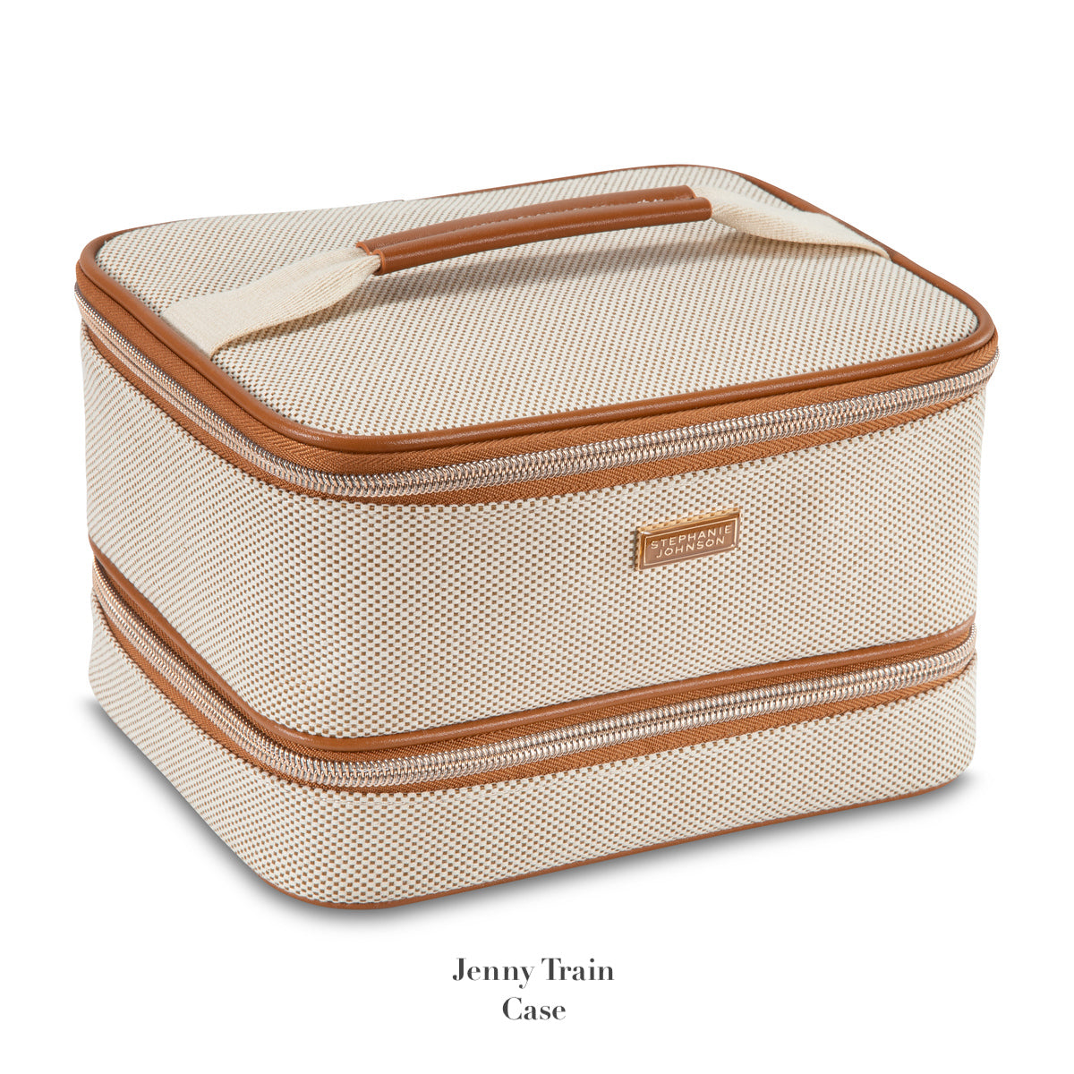 A beige textured train case with brown trim, zipper closure, and top handle from Stephanie Johnson's Tropea Travel Collection. Features removable compartments for organized storage and easy access to essentials.