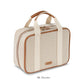 A beige and tan fabric rectangular travel bag with two handles, a zipper closure, and "Tropea Travel Collection" branding by Stephanie Johnson—perfect as a large cosmetic case with removable compartments for organized packing.