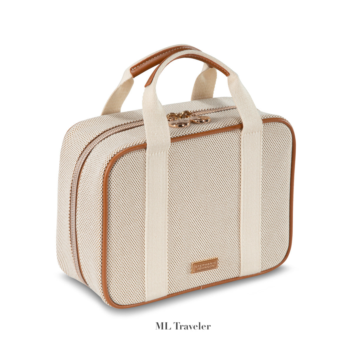 A beige and tan fabric rectangular travel bag with two handles, a zipper closure, and "Tropea Travel Collection" branding by Stephanie Johnson—perfect as a large cosmetic case with removable compartments for organized packing.