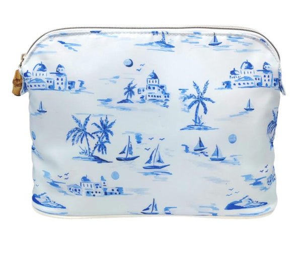 White custom printed twill TRVL Bag from the Cote D'Azur Collection with blue nautical and tropical prints, including sailboats, palm trees, and buildings, with a dome top zip closure by TRVL Design.