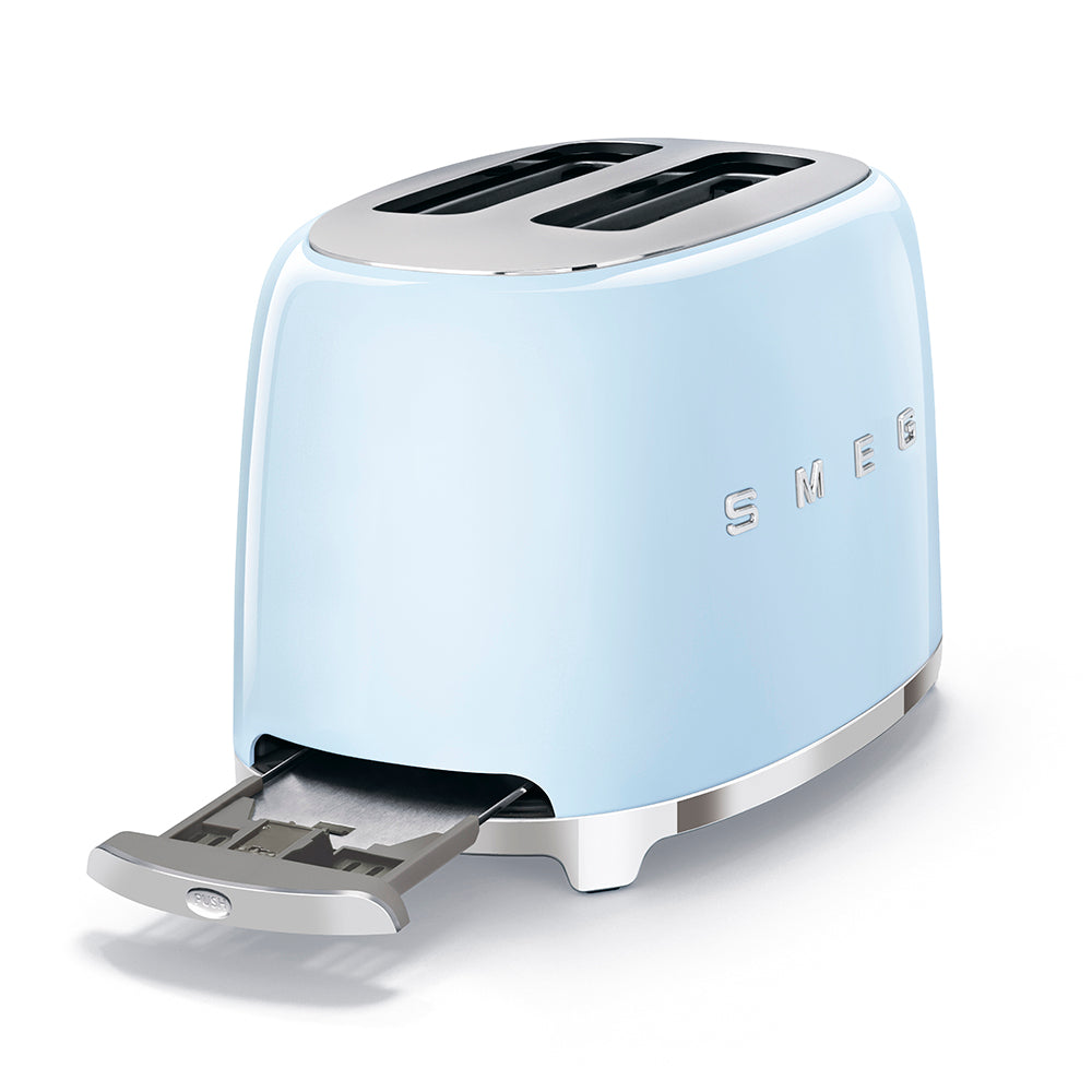 The SMEG 2-Slice Toaster Collection by Smeg has a retro design in light blue, featuring two extra-wide slots and a bottom slide-out crumb tray.