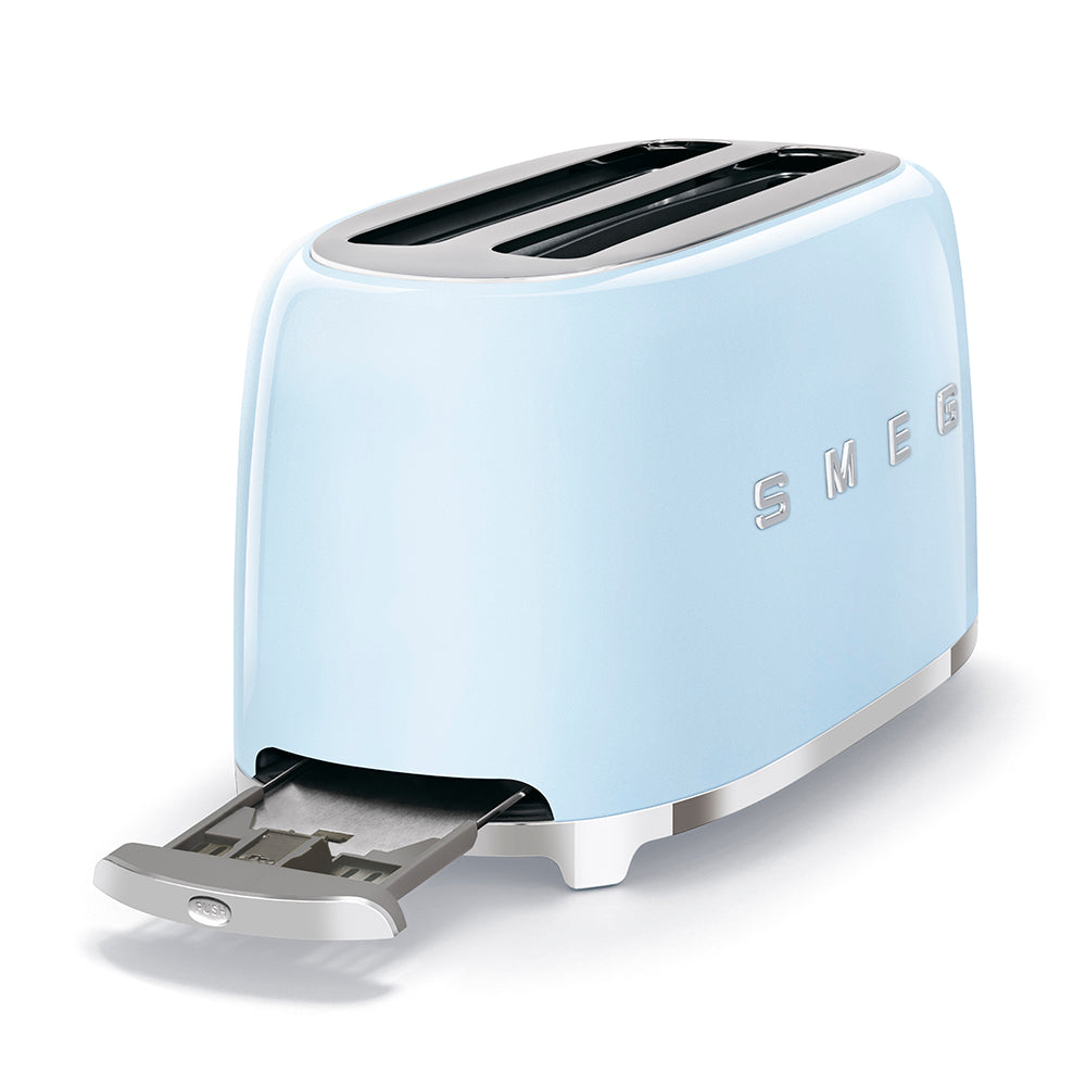 The Smeg SMEG 4-Slice Toaster Collection in light blue has two extra-wide slots, stainless steel accents, a powder-coated steel finish, and a convenient crumb tray. It features six browning levels for perfect toasting and complements any kitchen décor.