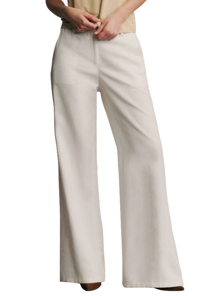 Woman wearing white high-waisted TWP Howard Linen Pant, straight-leg pants.