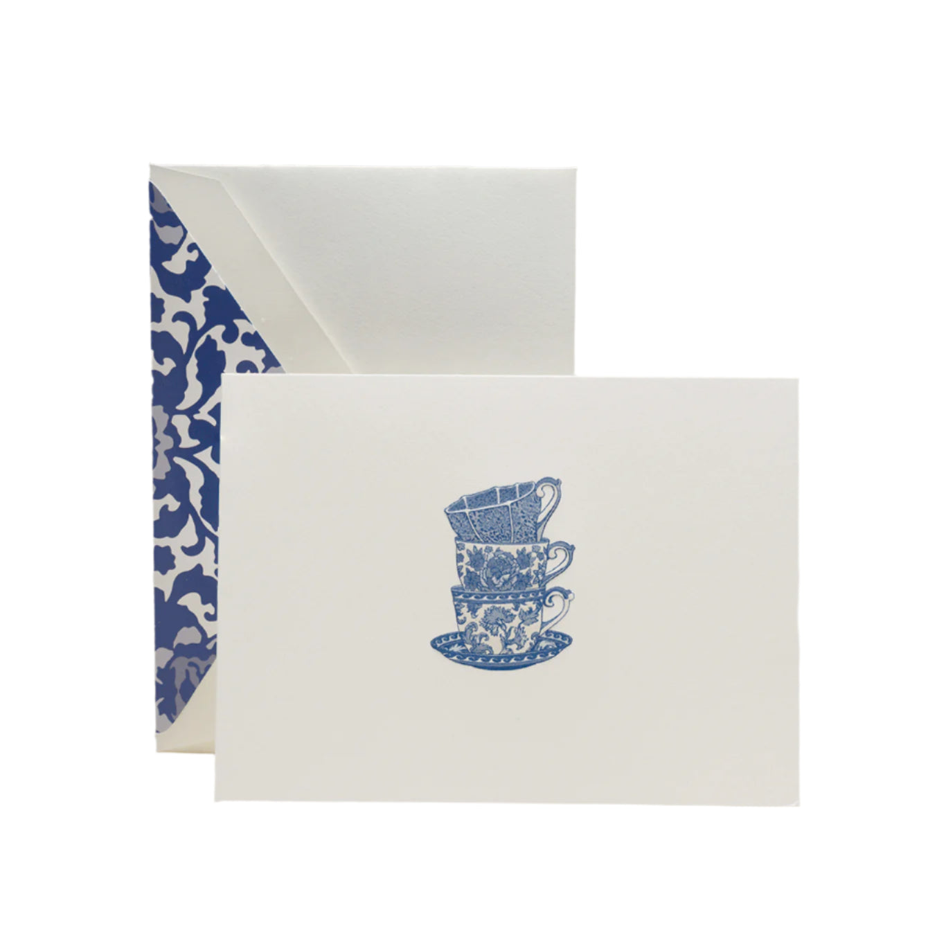 The Crane Tea Cups Card Set includes pearl white folded notes with an illustration of three stacked blue teacups and saucers, each paired with a blue and white toile-lined envelope—ideal for thoughtful thank-you notes.