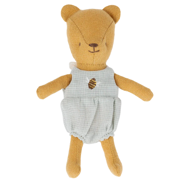 A Maileg Teddy Baby by Maileg, dressed in a soft linen fabric light blue checkered outfit adorned with a bee emblem on the front, makes the perfect addition to any teddy family.