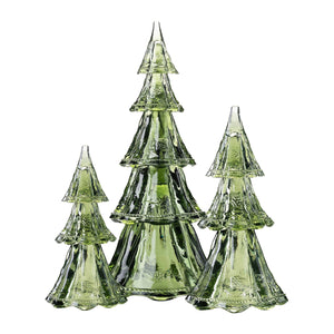 The Juliska Berry & Thread Evergreen Tree Collection features three green glass trees of varying heights, beautifully displayed on a white background—ideal as festive holiday table decor.