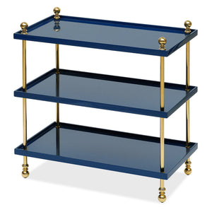 Bunny Williams Tiered Drinks Table features three rectangular shelves in blue lacquer with brass posts, finials, and feet, showcased against a white background.