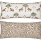 The Matouk Reversible Lumbar Pillow Collection offers versatile home decor with one side featuring tigers, palm trees, and flowers on white, and the other a tan and white zebra stripe pattern.