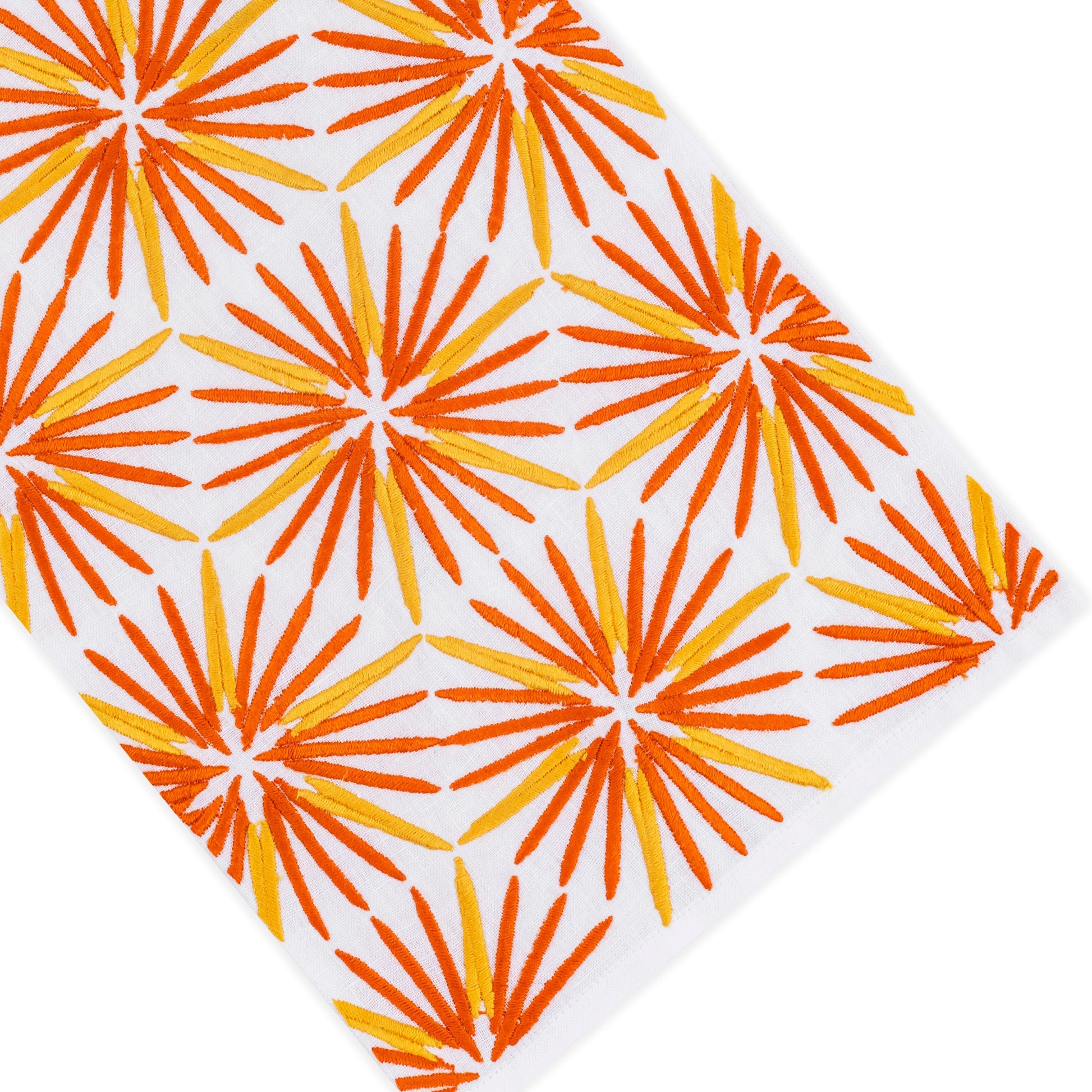White surface with an angled pattern of orange and yellow starburst shapes evenly spaced across the image, evoking the timeless elegance of premium linen for refined home décor in the Haute Home Radiant Bath Collection.
