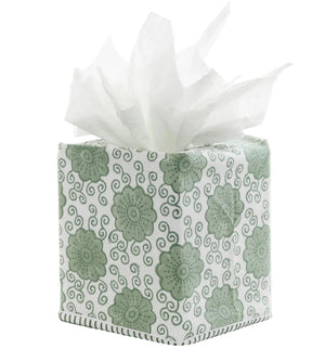 The Damini Sage Tissue Box Cover by John Robshaw features a hand block printed sage green rosette floral design, finished with delicate hand-stitched edging, and is shown holding white tissues emerging from the top.