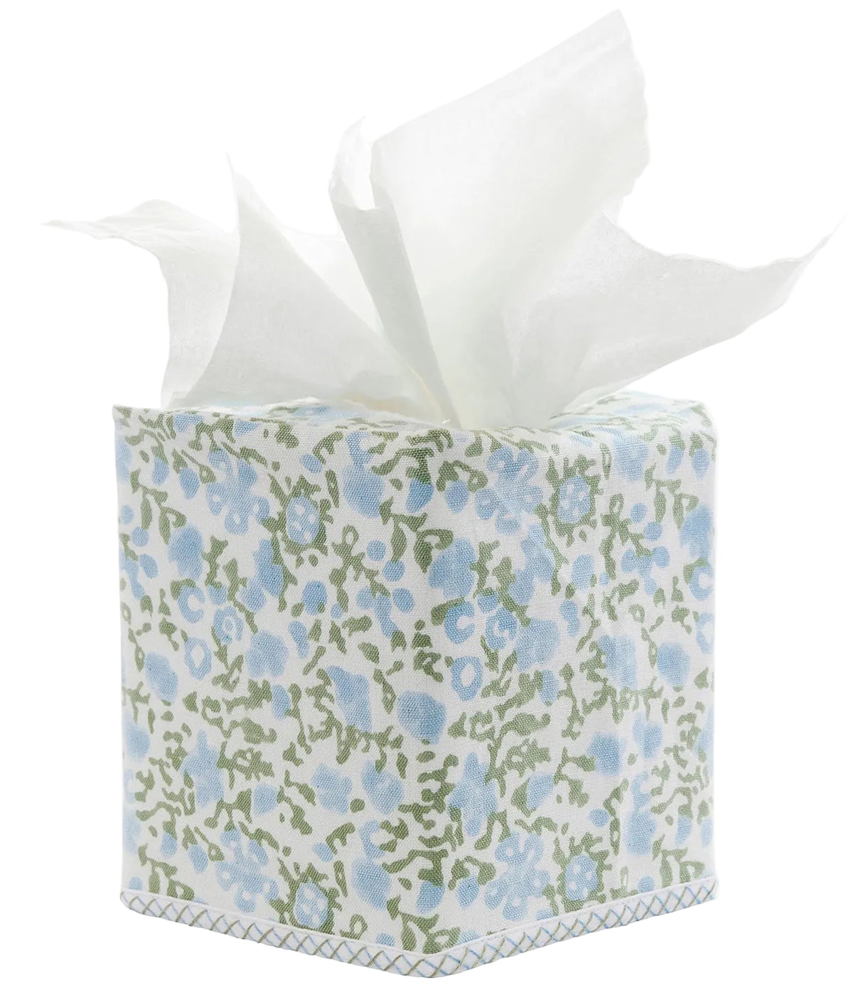 The Ekisha Tissue Box Cover by John Robshaw is a hand block printed piece inspired by Jaipur, showcasing a blue and green floral pattern with several white tissues pulled out from the top.