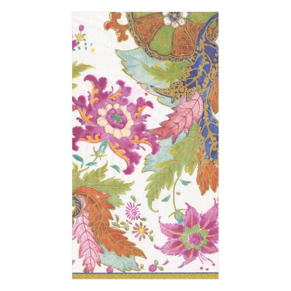 The Caspari Tobacco Leaf Ivory Collection napkin is a decorative, eco-friendly triple-ply napkin featuring floral and paisley patterns in pink, orange, green, and gold on a white background.