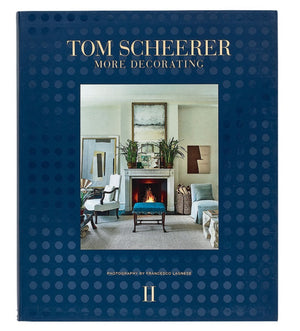 A book titled "The Tom Scheerer Compendium" by Vendome showcases American interior design with a living room scene on the cover. It features modern furnishings, art, a fireplace, and photography by Francesco Lagnese, epitomizing Tom Scheerer's signature Relaxed Modernism.