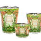 The Baobab Collection Tomorrowland Candle set features three decorative candles of varying sizes, adorned with floral patterns in green, pink, and orange hues that exude an Art Nouveau elegance. The intricate designs capture the essence of pear lily of the valley moss, subtly fragrancing your space with an enchanting nod to Tomorrowland.